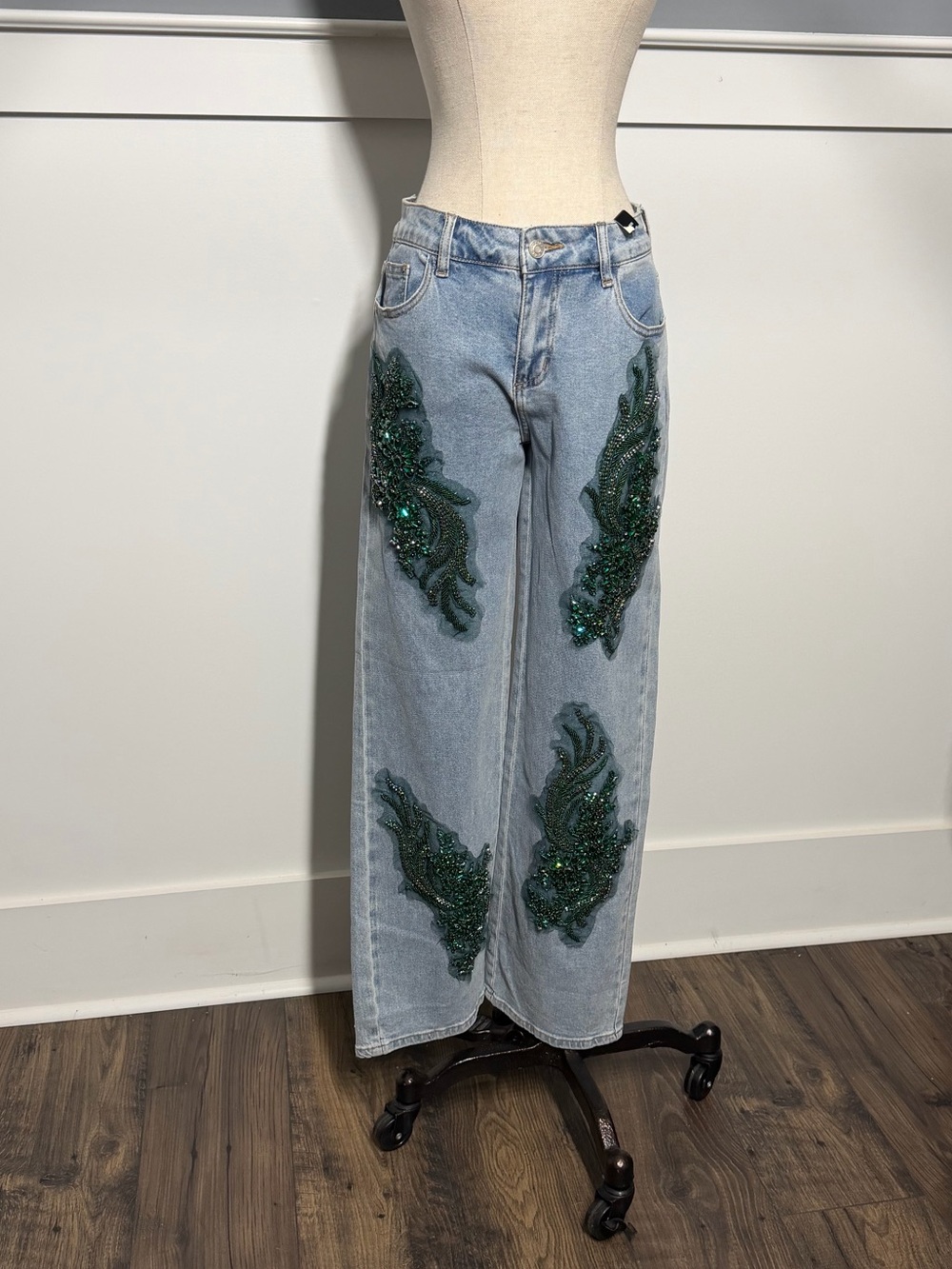 AKIRA Light Wash Wide-Leg Jeans with Green Sequin Appliqués